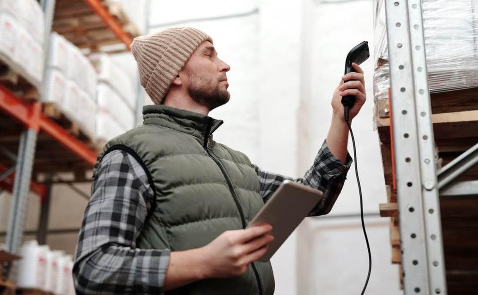Warehouse worker scanning stock